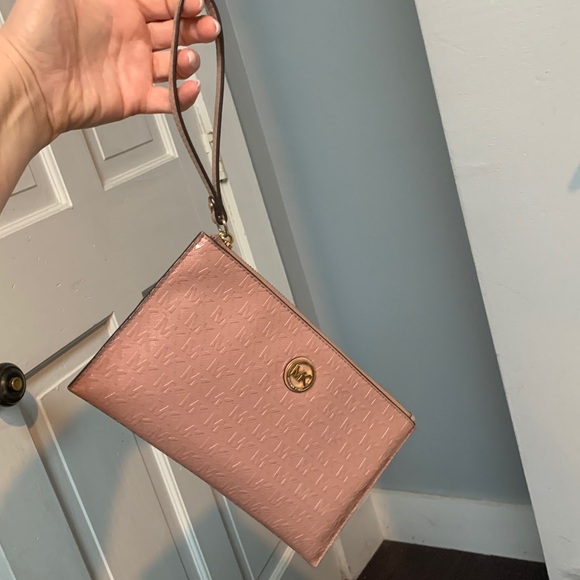 Authentic soft pink patent leather large wristlet clutch by Michael Kors